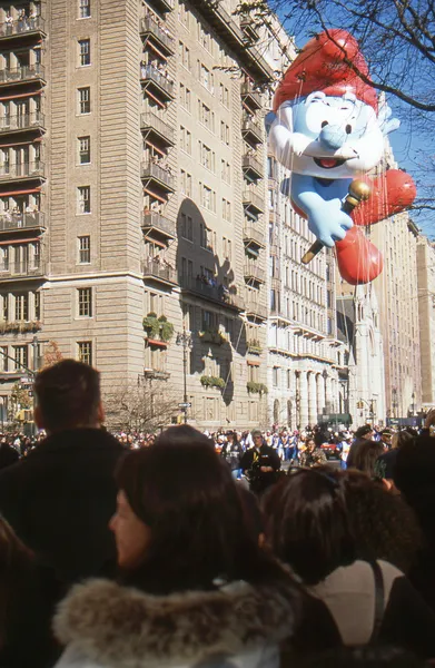 NEW YORK-NOV 22: A holiday tradition since 1924, the annual Macy\'s Thanksgiving Day Parade is seen by more than 3.5 million people. Pictured here in 2012 is the Papa Smurf balloon.