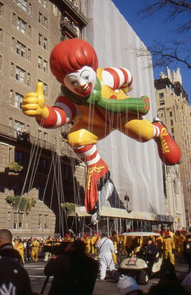 NEW YORK-NOV 24: A holiday tradition since 1924, the annual Macy\'s Thanksgiving Day Parade is seen by more than 3.5 million people. Pictured here in 2011 is an ice skating Ronald McDonald.