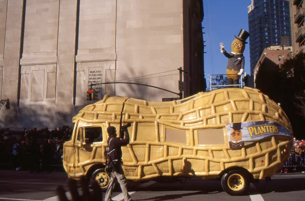 NEW YORK-NOV 24: A holiday tradition since 1924, the annual Macy\'s Thanksgiving Day Parade is seen by more than 3.5 million people. Pictured here in 2011 is Planter\'s Mr. Peanut standing atop his car.