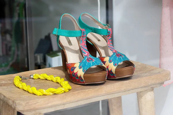 Woman sandals and necklace in a shop