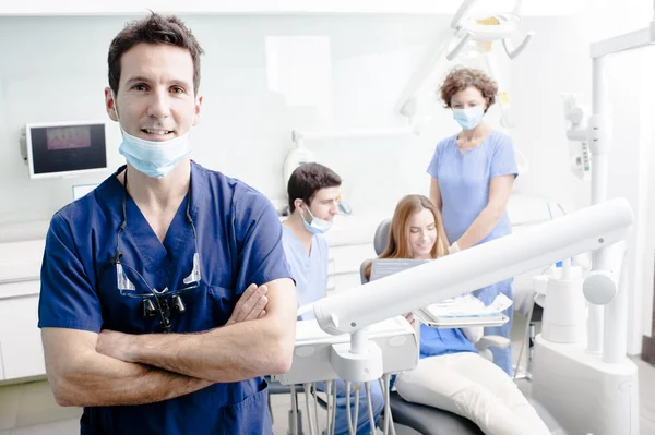 Dentist showing a client something about dental treatament