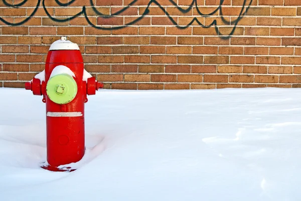 Red fire hydrant in winter