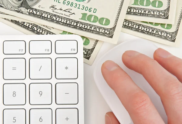 Money, keyboard and hand on computer mouse