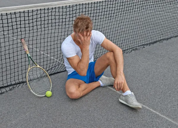 Lost game. Disappointed tennis player.