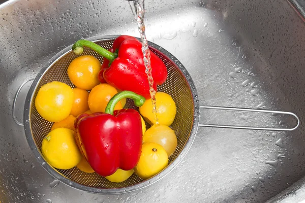 Washing colorful fruits and vegetables