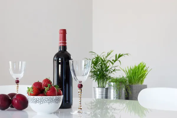 Red wine, fruits and elegant glasses