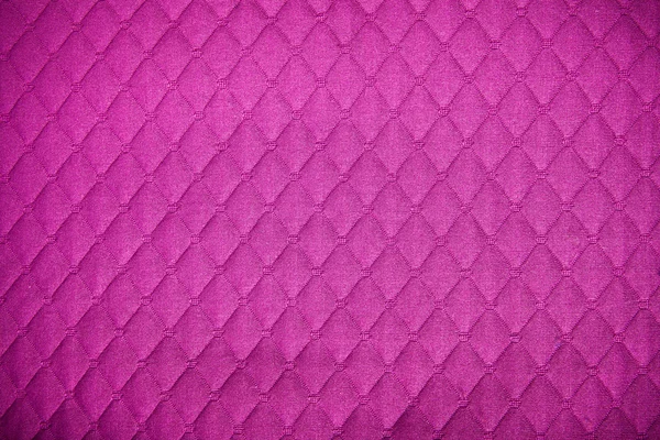 Purple textile background with diamond pattern