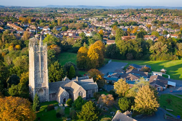 Aerial view of a British village with church and school