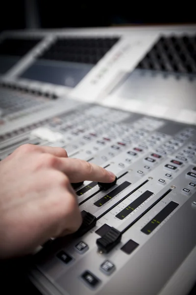 Hand on Sound Mixing desk in Television Gallery