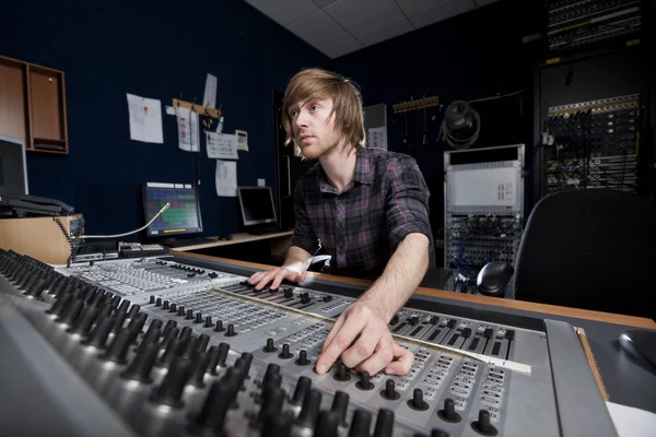 Man using a Sound Mixing Desk