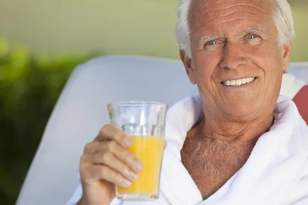 Healthy Happy Senior Man Drinking Orange Juice