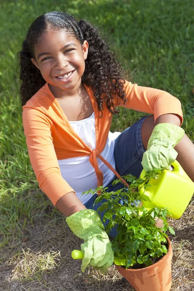 African American Girl Child Gardening Planting Flowers