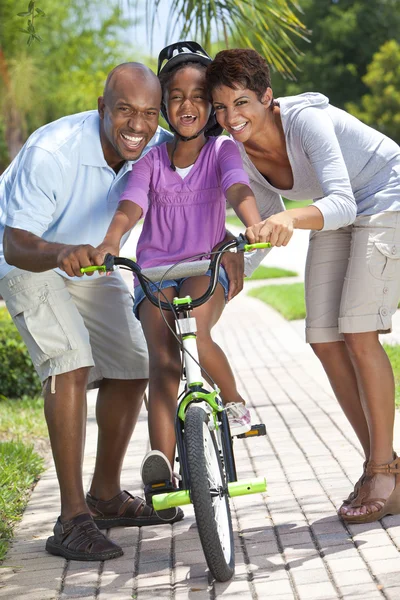 African American Family WIth Girl Riding Bike & Happy Parents