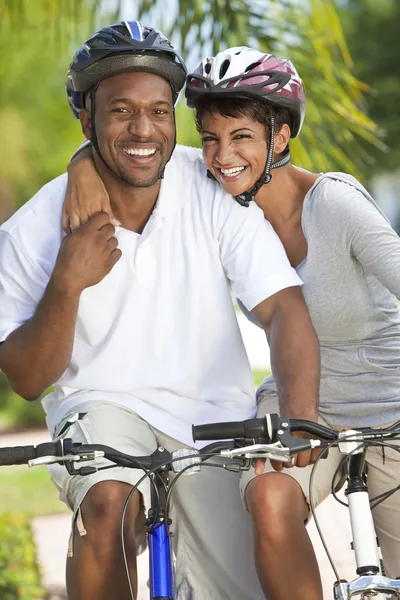 Happy African Man & Woman Couple Riding Bike Smiling