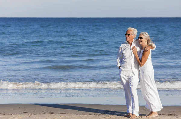 Happy Senior Couple Embracing on Tropical Beach