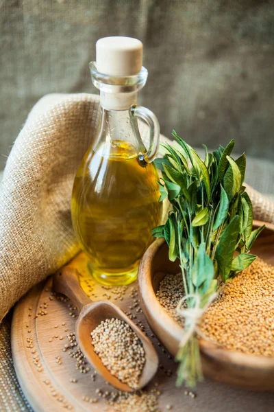 Mustard oil in a vessel with seeds