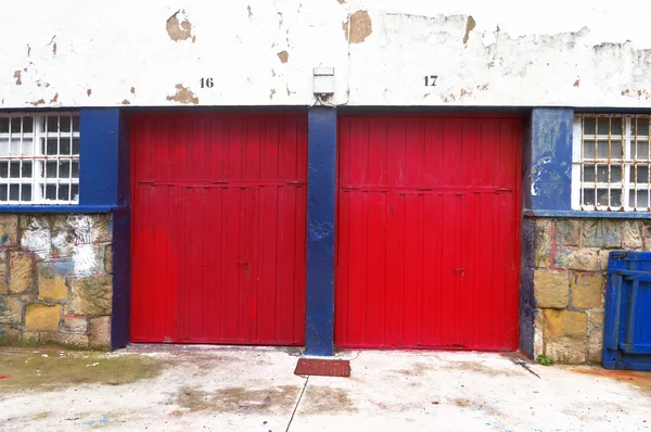 Two garages with roller shutters