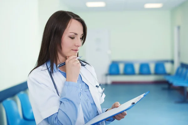 Female doctor checking medical results