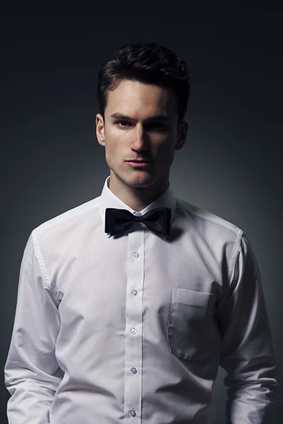 Man wearing in a shirt and bow tie