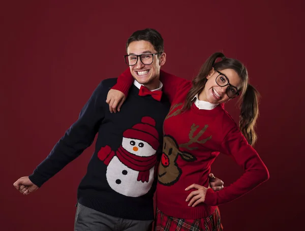 Nerd couple wearing funny sweaters
