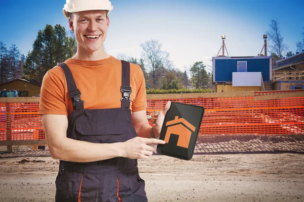 Construction worker showing plan from tablet