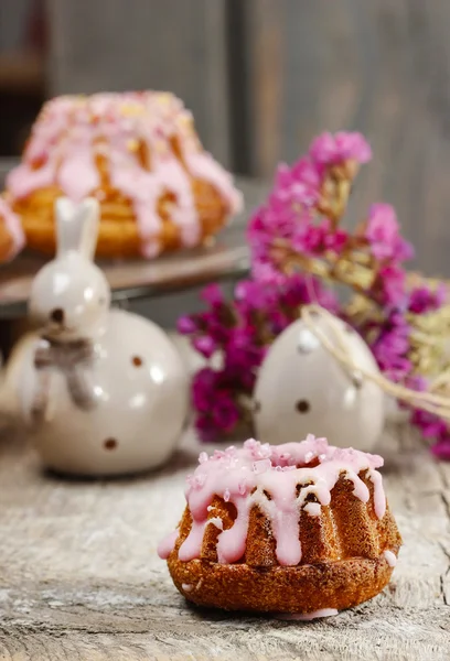 Traditional easter yeast cake covered with pink icing and color