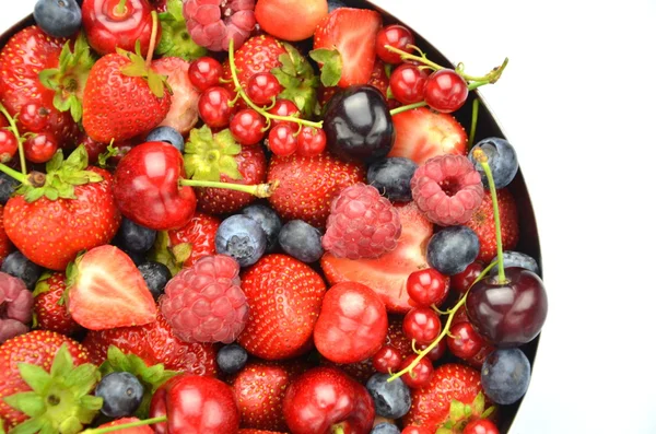 Variety of soft fruits, strawberries, raspberries, cherries, blueberries, currants isolated on white