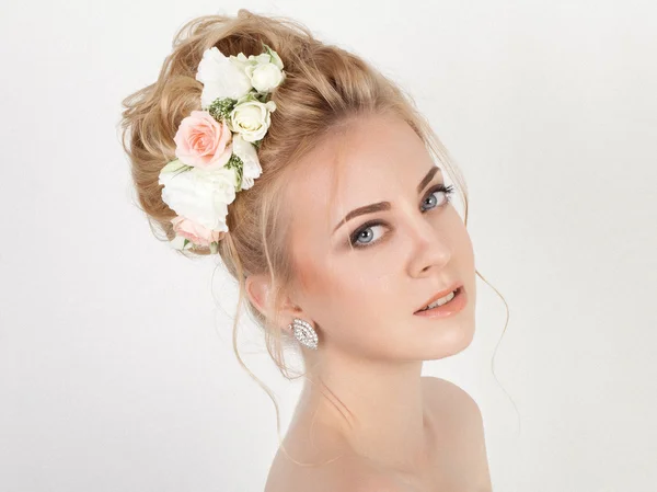 Beauty woman with wedding hairstyle and makeup. Bride fashion.