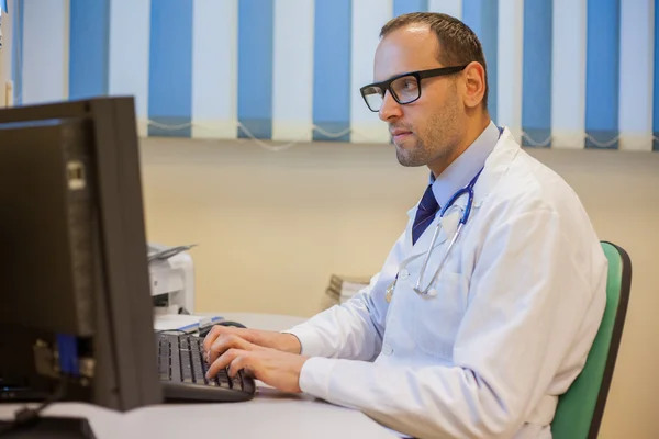 Doctor working with computer
