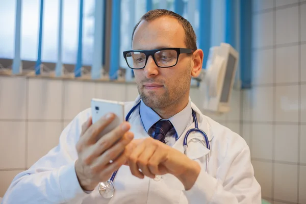 Doctor with mobile phone
