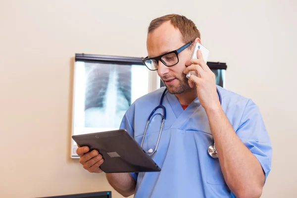 Doctor with tablet and mobile phone