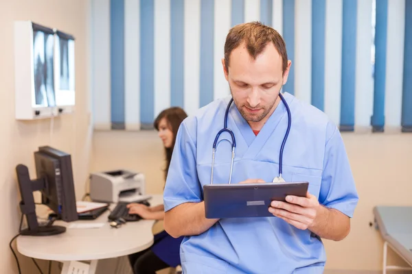 Doctor with tablet