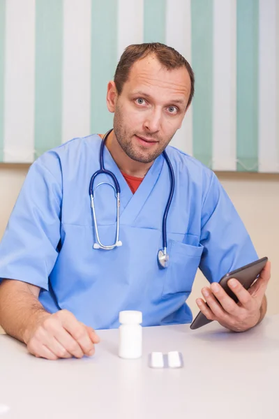 Doctor holding tablet