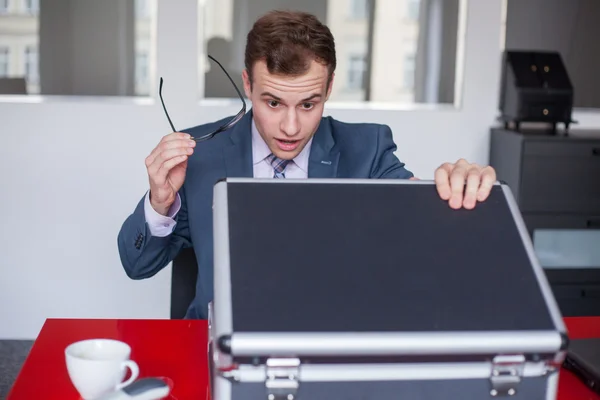 Surprised businessman with briefcase