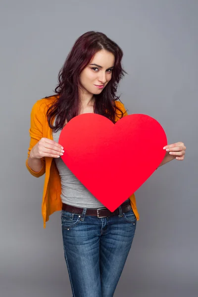 Woman holding paper heart