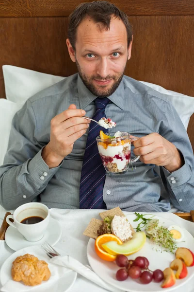 Businessman having breakfast