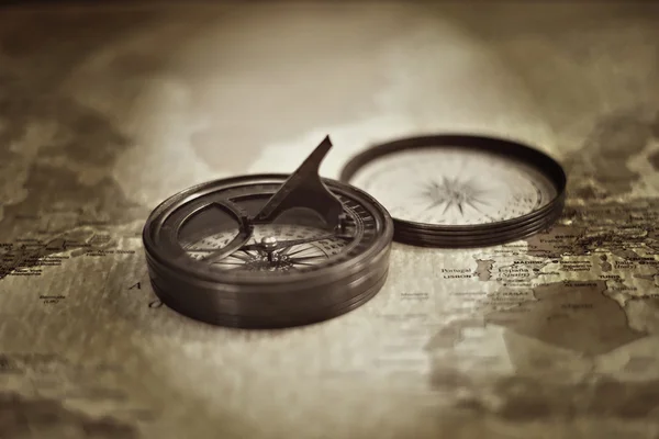Vintage Sundial Compass On Top Of Old World Map