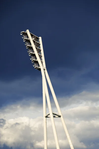 Stadium Lighting Tower and Cloudy Sky