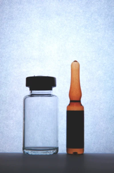 Silhouette of injection vial and ampule show laboratory concept