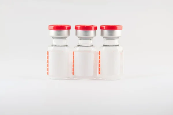 Red cap vial on white background