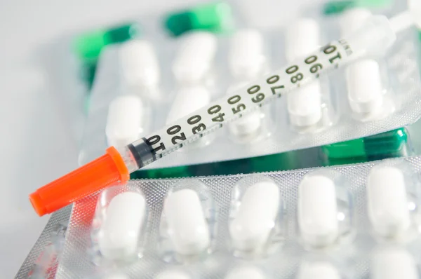 Closed up disposable syringe on blister pack medicine