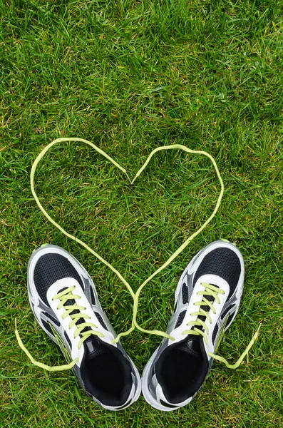 Sneakers on grass with heart