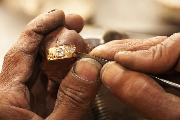 Goldsmith working on an unfinished 22 carat gold Wedding ring