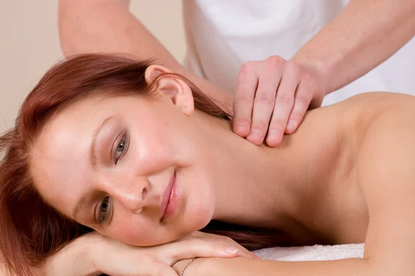 Woman lying on massage table