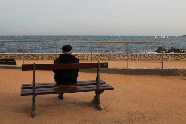Man on Bench, next to the sea