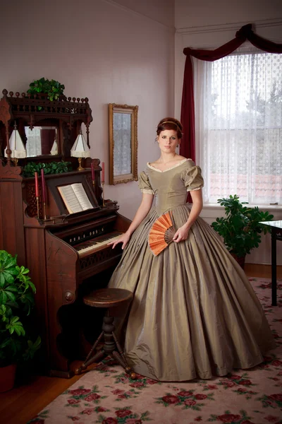 Civil War Historical Woman Standing by Pump Organ