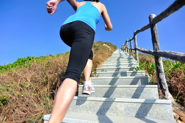 Woman running up on the  stairs