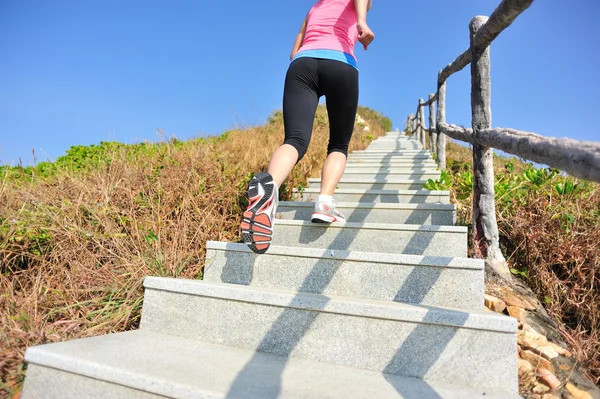 Woman running up on the  stairs