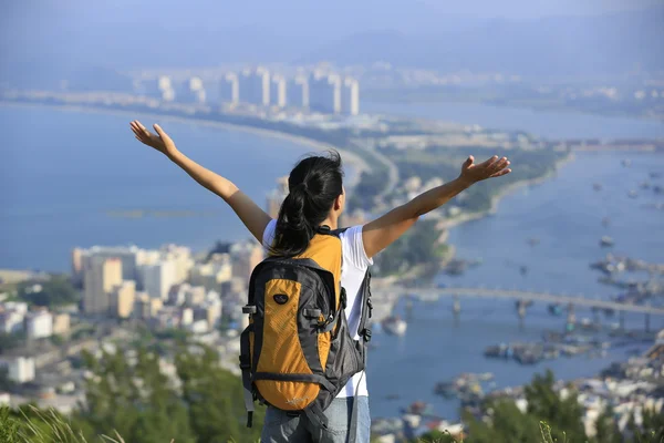 Woman hiker open arms