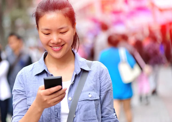 Woman using smart phone